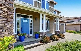 Front porch of a home with a blue door