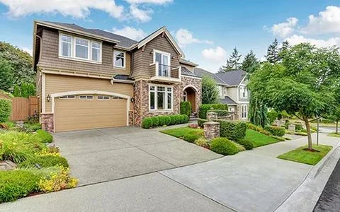 Two-story craftsman home with a landscaped front yard